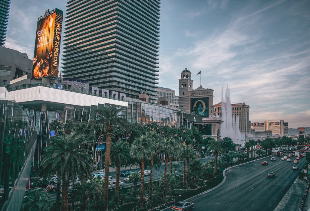 Vibrant view of Las Vegas's iconic skyline and busy boulevard with modern buildings and neon lights.